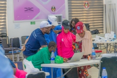 Facilitator-supporting-participants-at-the-AGILE-Games-2025-AI-Hackthon-on-May-28-2025-in-Abuja-scaled