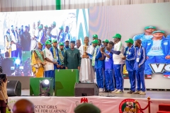 Federal-Minister-of-Education-alongside-the-Governor-of-Borno-State-holding-the-trophy-with-the-winning-team-at-the-AGILE-Games-Award-Ceremony-scaled