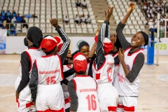 Female-basketball-team-members-cheering-up-during-the-AGILE-Games-basketball-competition-scaled