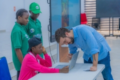 Lead-facilitator-guiding-a-participant-at-the-AGILE-Games-2025-AI-Hackthon-on-May-29-2025-in-Abuja-scaled